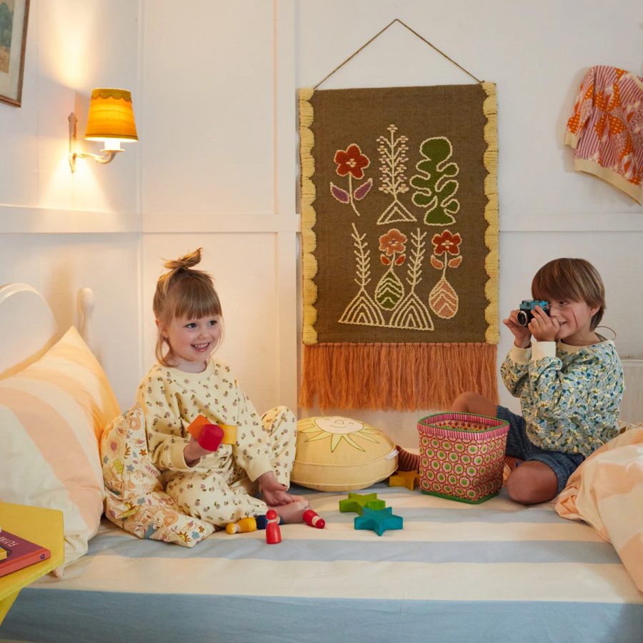 sage x clare southall woven wall hanging kids on bed